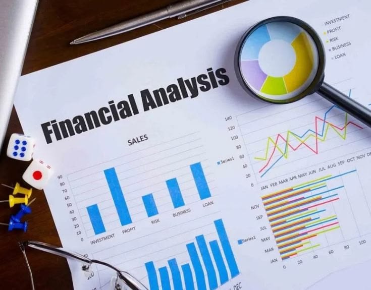Financial analysis charts with a magnifying glass